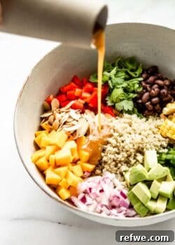 A vibrant and colorful Southwest Quinoa Salad, perfectly mixed and ready to be served.
