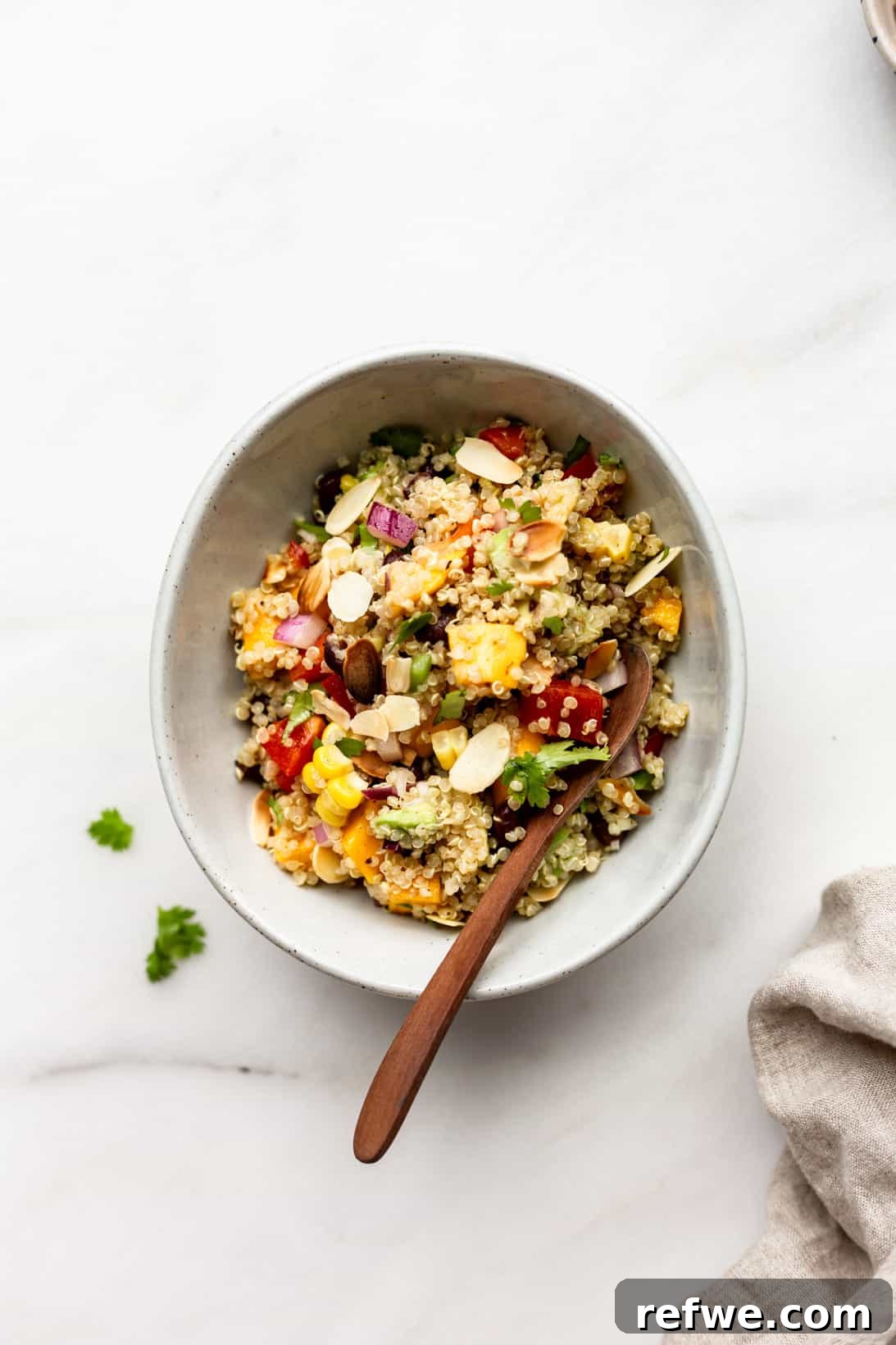 Zesty Southwestern Quinoa Power Bowl 6 A vibrant bowl of Southwest Quinoa Salad resting on a pristine linen napkin, showcasing its fresh and inviting colors.