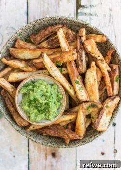 Delicious crispy oven baked fries on a serving board