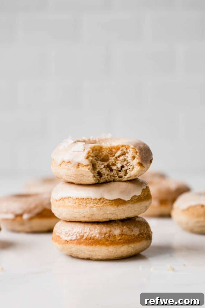 Sweet & Salty Vegan Maple Rings 2 A stack of three beautifully glazed vegan salted maple donuts