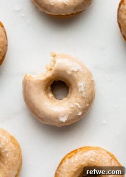 Maple donuts on a marble board topped with sea salt