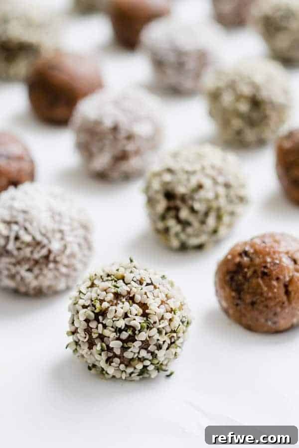 Almond Butter Energy Boosters 3 Close-up of a few no-bake almond butter energy bites, highlighting their texture