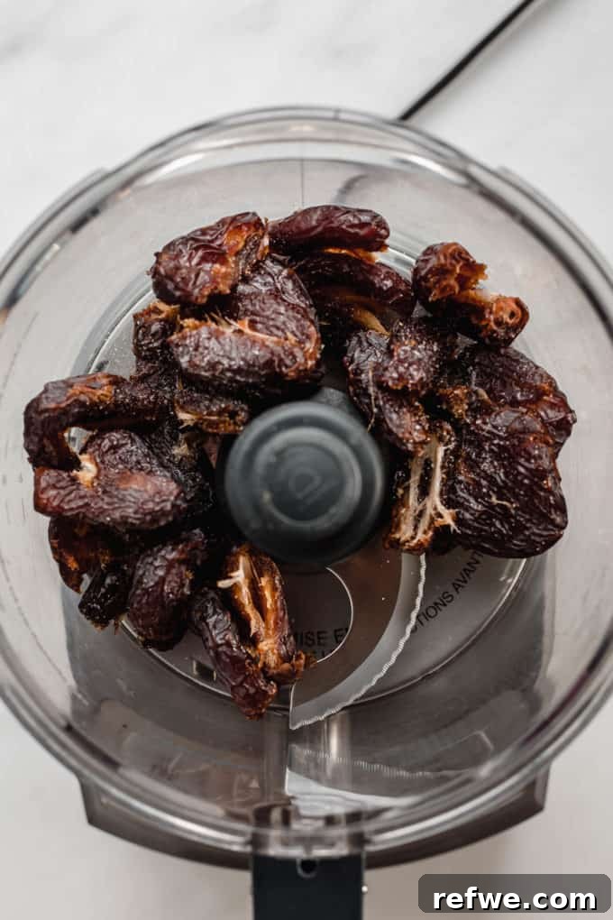 Wholesome Chocolate Turtles 3 A food processor with fresh Medjool dates inside, ready to be blended