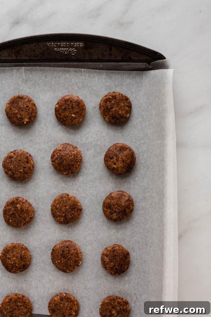 Wholesome Chocolate Turtles 5 A baking sheet with neatly formed date patties, ready for pecans