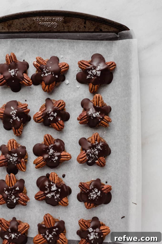 Wholesome Chocolate Turtles 8 A baking sheet filled with parchment paper and perfectly set healthy chocolate turtles