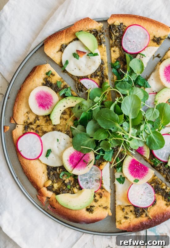 chickpea pizza crust baking in the oven, showing its golden texture