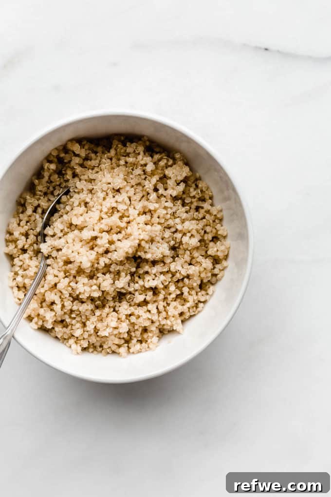 Morning Quinoa Nourishment 3 Perfectly cooked quinoa in a clean white bowl, ready to be transformed into a delicious breakfast.