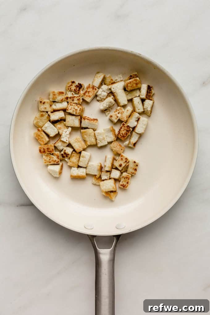 Squash Noodle Pad Thai 3 A white pan with neatly cubed firm tofu, ready for cooking