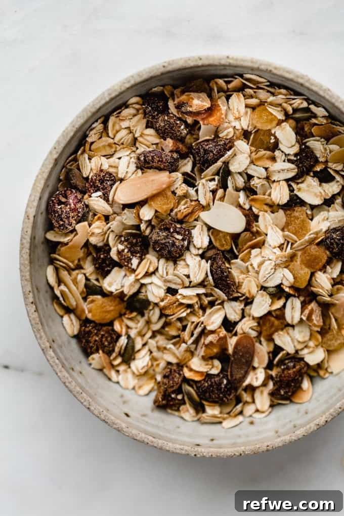 Effortless Wholesome Muesli 7 A beautifully arranged ceramic bowl filled with homemade muesli, ready to be enjoyed for breakfast