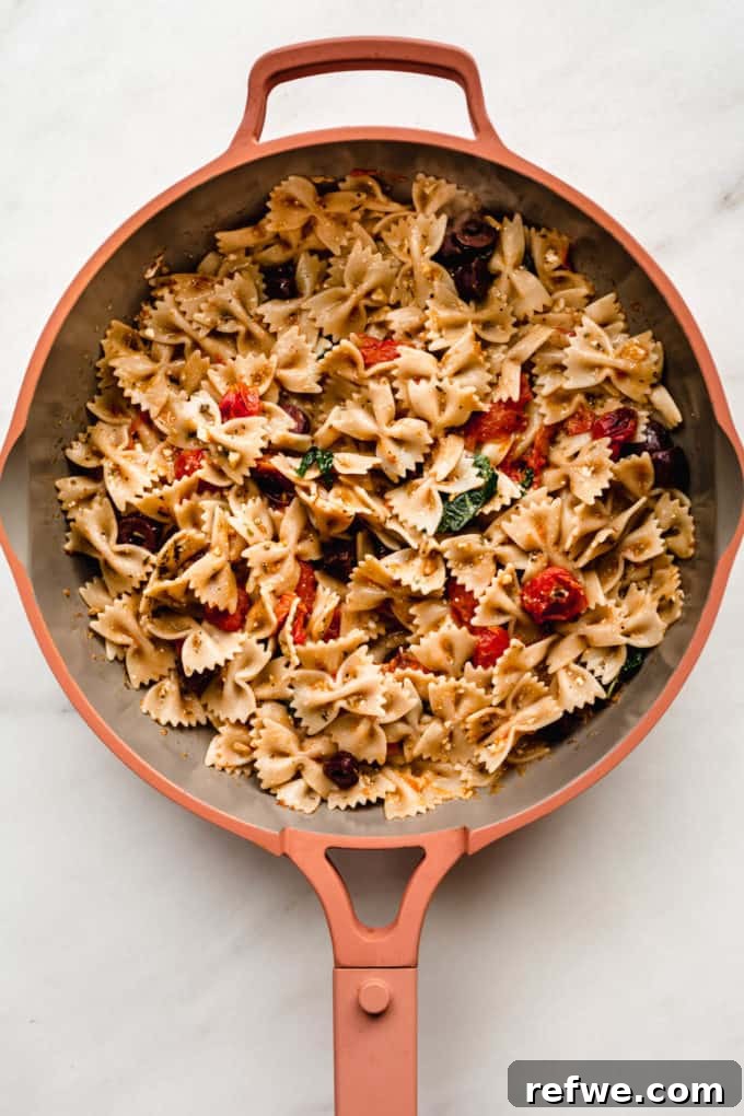 Sun-Drenched Mediterranean Pasta 5 Mediterranean farfalle pasta served in a stylish pink pan