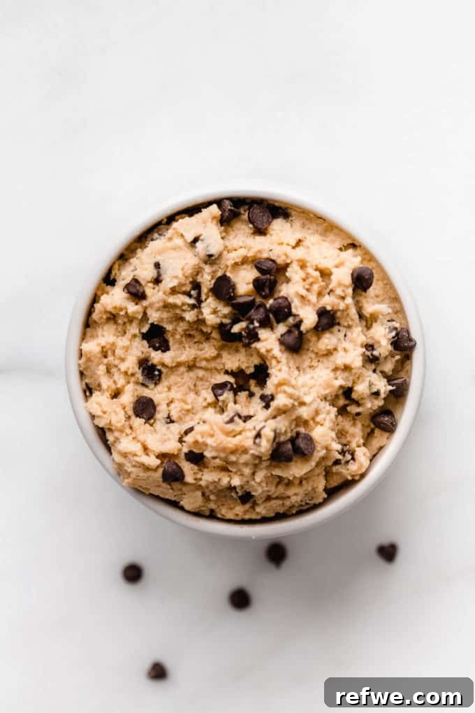 Creamy Almond Chickpea Cookie Dough 2 chickpea cookie dough in a small bowl with chocolate chips on top