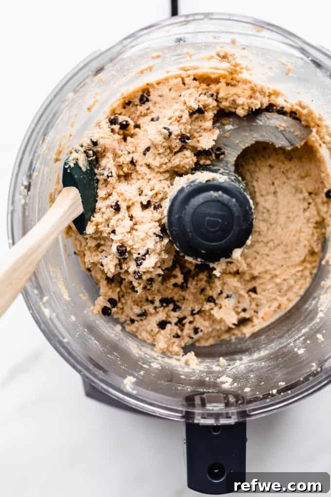 Creamy Almond Chickpea Cookie Dough 6 chocolate chip chickpea cookie dough in a food processor