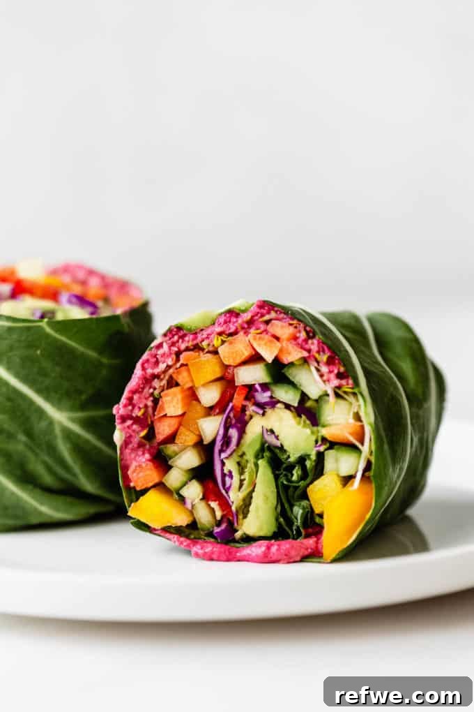 Vibrant Garden Collard Wraps 2 A beautifully arranged rainbow collard green wrap on a clean white plate, showcasing vibrant fresh vegetables.