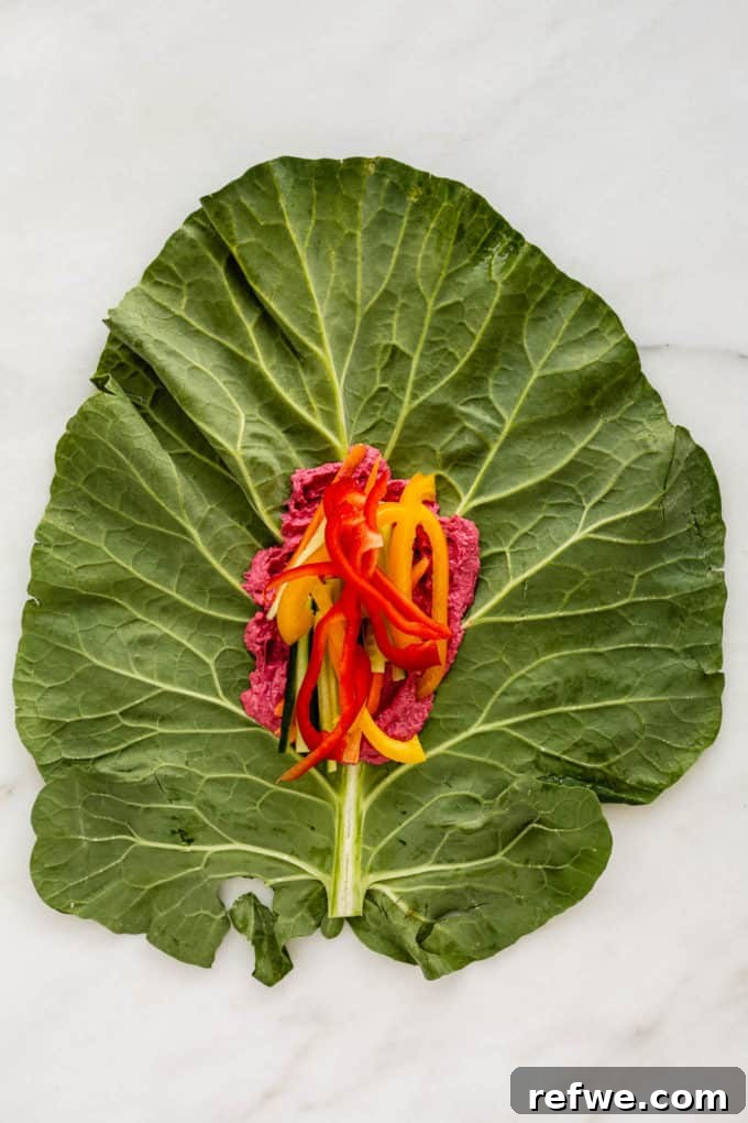 Vibrant Garden Collard Wraps 5 Colorful bell pepper strips added to the collard wrap filling, layered over hummus and cucumber.