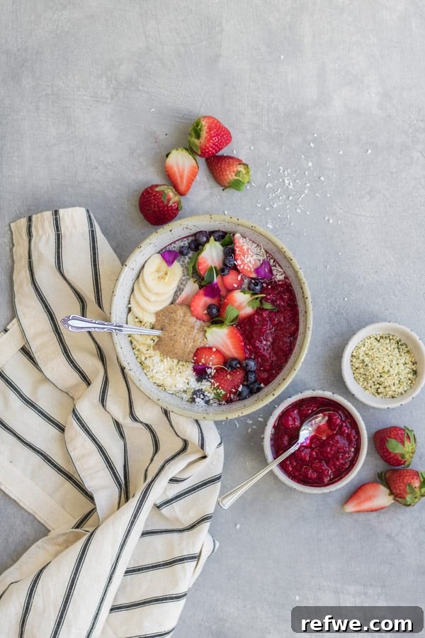 Sunrise Harvest Bowl 2 Vibrant Hippie Breakfast Bowl topped with fresh berries and almond butter, ready for a healthy start to the day.
