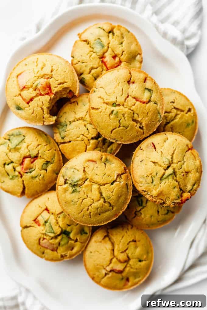 Several chickpea flour mini quiches artfully arranged on a white serving platter, ready to be enjoyed as a delightful and healthy breakfast.