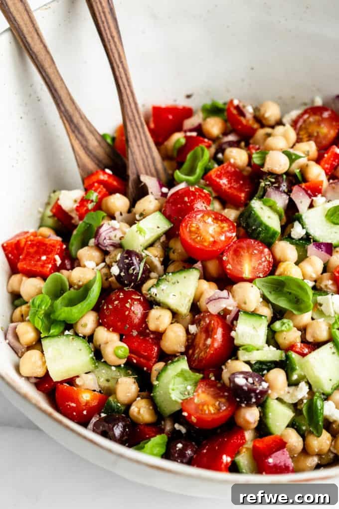 Vibrant Mediterranean Chickpea Salad 6 A refreshing Mediterranean Quinoa Salad presented beautifully in a serving bowl, showcasing its diverse ingredients and inviting appeal.