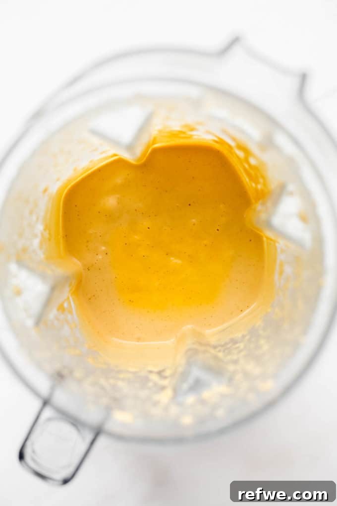 Ultimate Dairy-Free Queso 5 The vegan queso is now smooth and creamy inside a blender, after being fully processed.