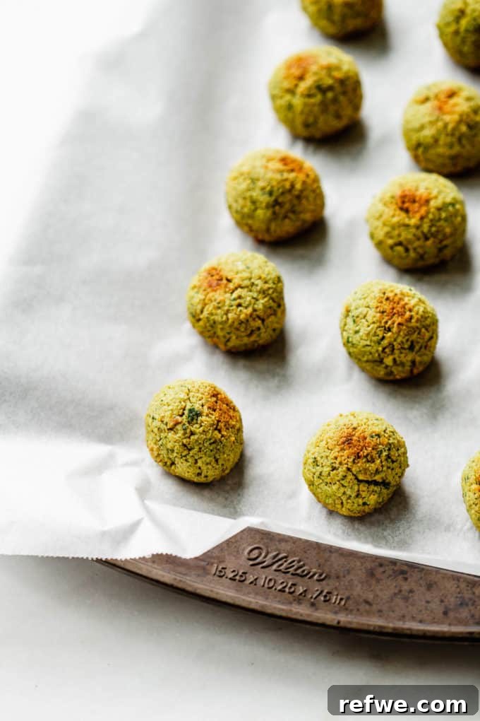 Crispy Oven-Baked Vegan Falafel 7 Neatly arranged unbaked falafel balls placed on a baking sheet, ready for the oven