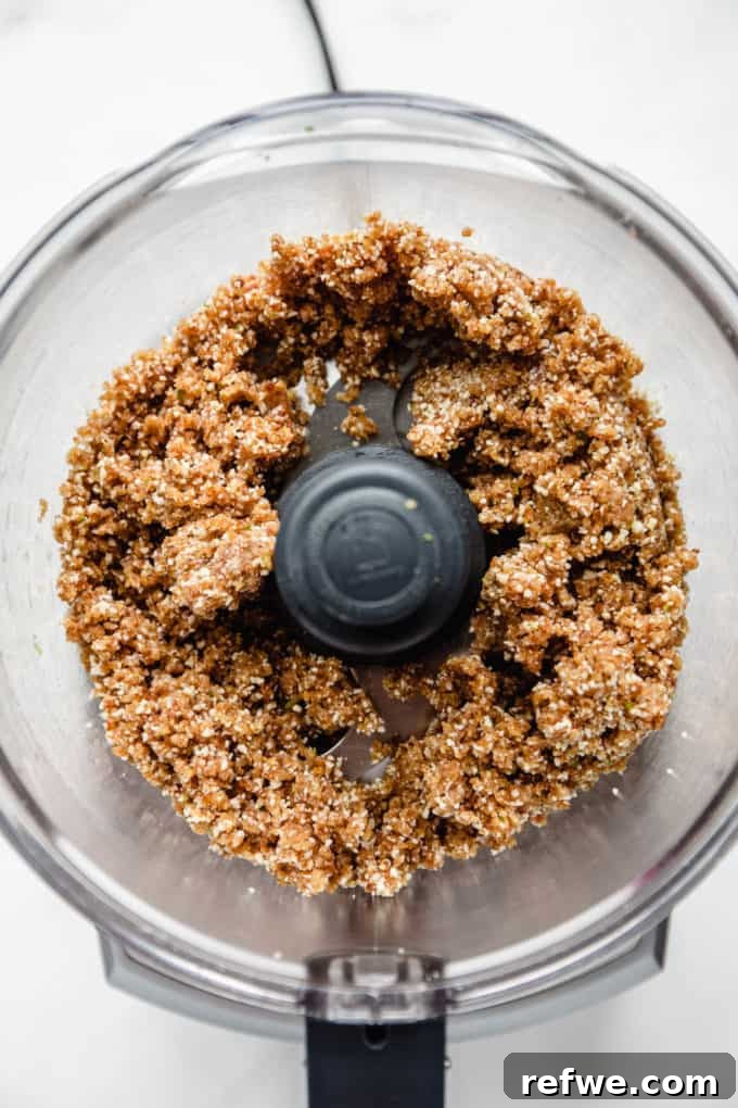 Key Lime Power Bites 6 The key lime energy ball mixture after blending in a food processor, showing its smooth, cohesive texture.