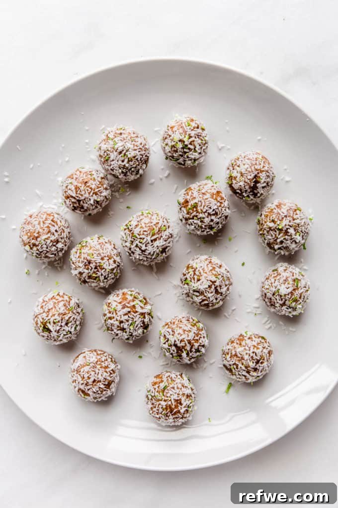 Key Lime Power Bites 8 Key Lime Pie Energy Balls beautifully arranged on a white plate, showcasing their inviting appearance.