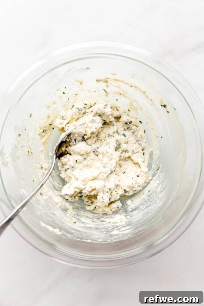 Creamy Ricotta Zucchini Pinwheels 6 Mixed up ricotta and herbs in a mixing bowl