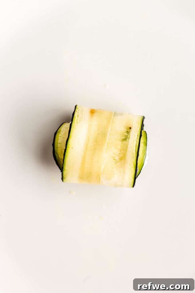 Creamy Ricotta Zucchini Pinwheels 8 A slice of zucchini rolled up with ricotta stuffing in it