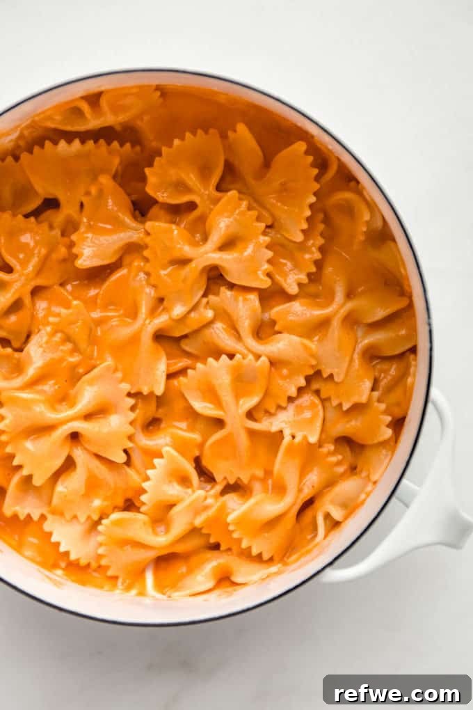 Velvety Vegan Vodka Pasta 11 A white pot filled with the finished vegan vodka pasta, ready to be served.