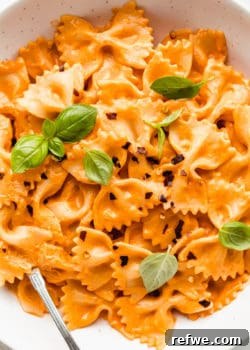 A bowl of farfalle pasta with vegan vodka sauce on it
