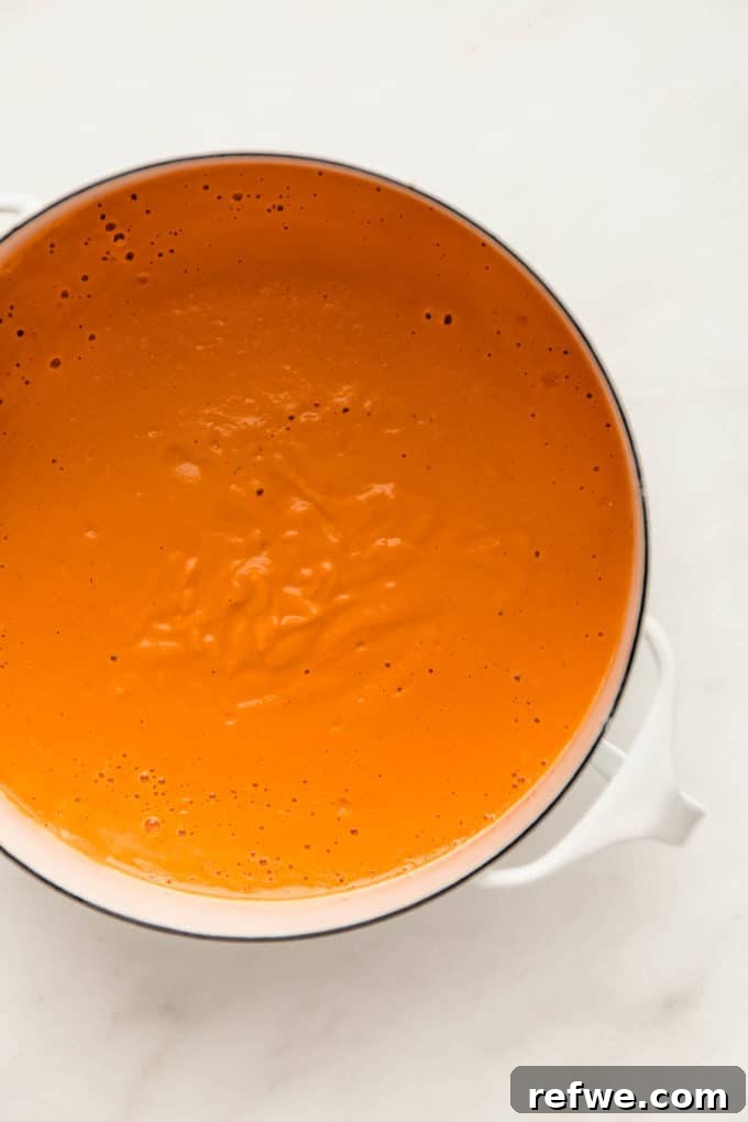 Velvety Vegan Vodka Pasta 9 A white pot holding the creamy vegan vodka sauce, ready for the addition of pasta.