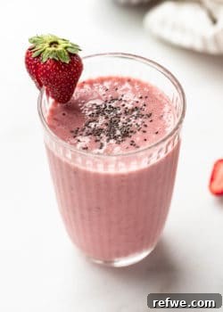 A strawberry chia seed smoothie in a glass, ready to be enjoyed as a healthy meal or snack.