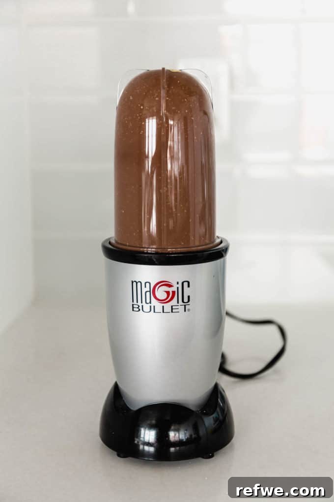 Morning Chocolate Indulgence 5 Smooth, blended chocolate oat batter in a magic bullet, ready for baking.