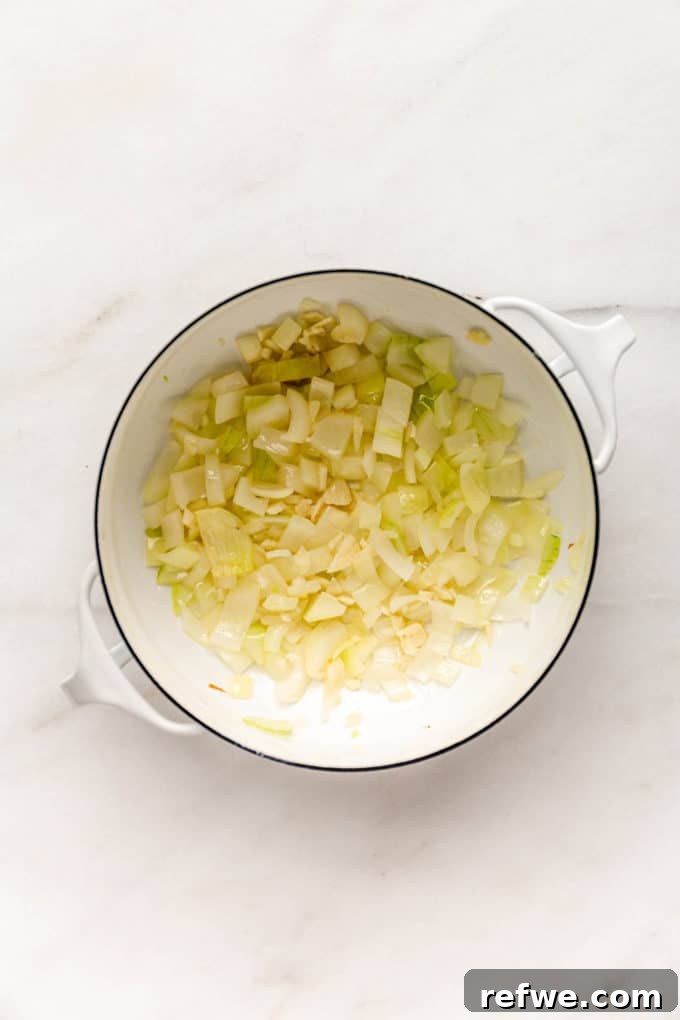 Irresistible Vegan Chili 4 onions and garlic in a white pot