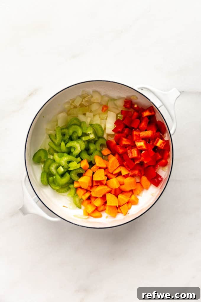 Irresistible Vegan Chili 5 carrots, celery, carrots and onions in a white pot