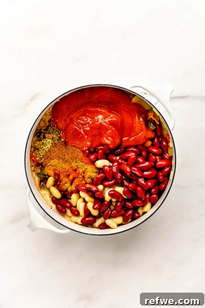 Irresistible Vegan Chili 7 beans, tomatoes and spices in a white pot