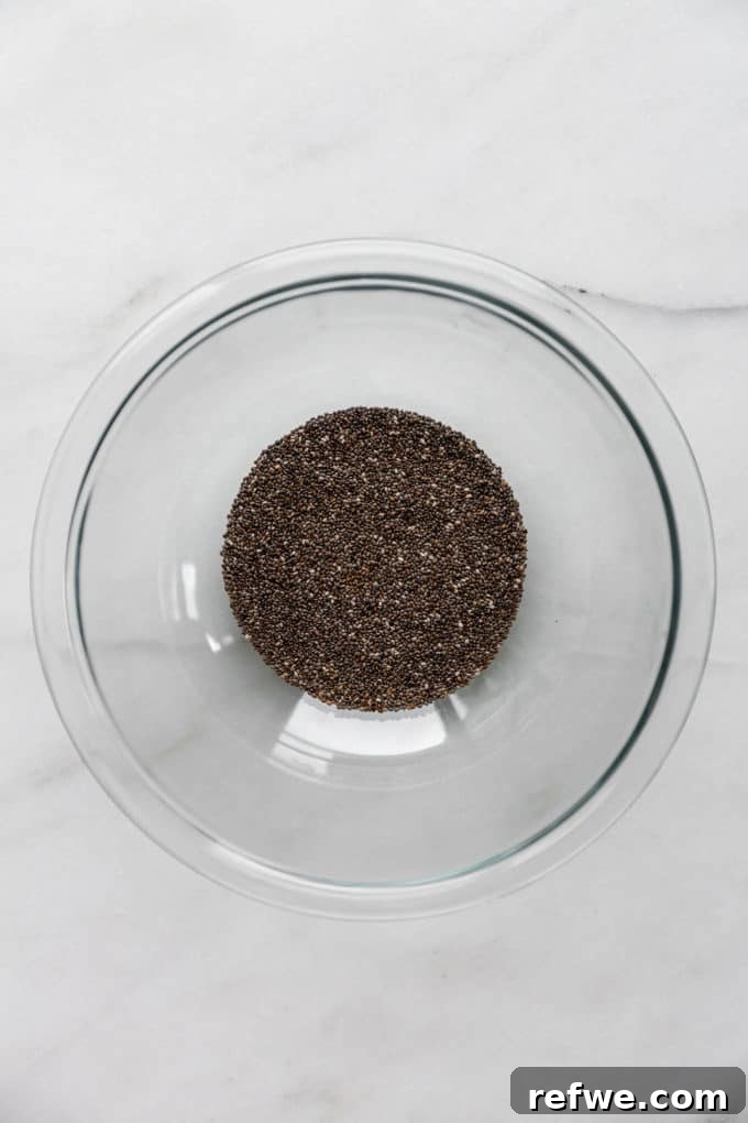 Festive Eggnog Chia Pudding 4 chia seeds in a clear mixing bowl, ready for the liquid