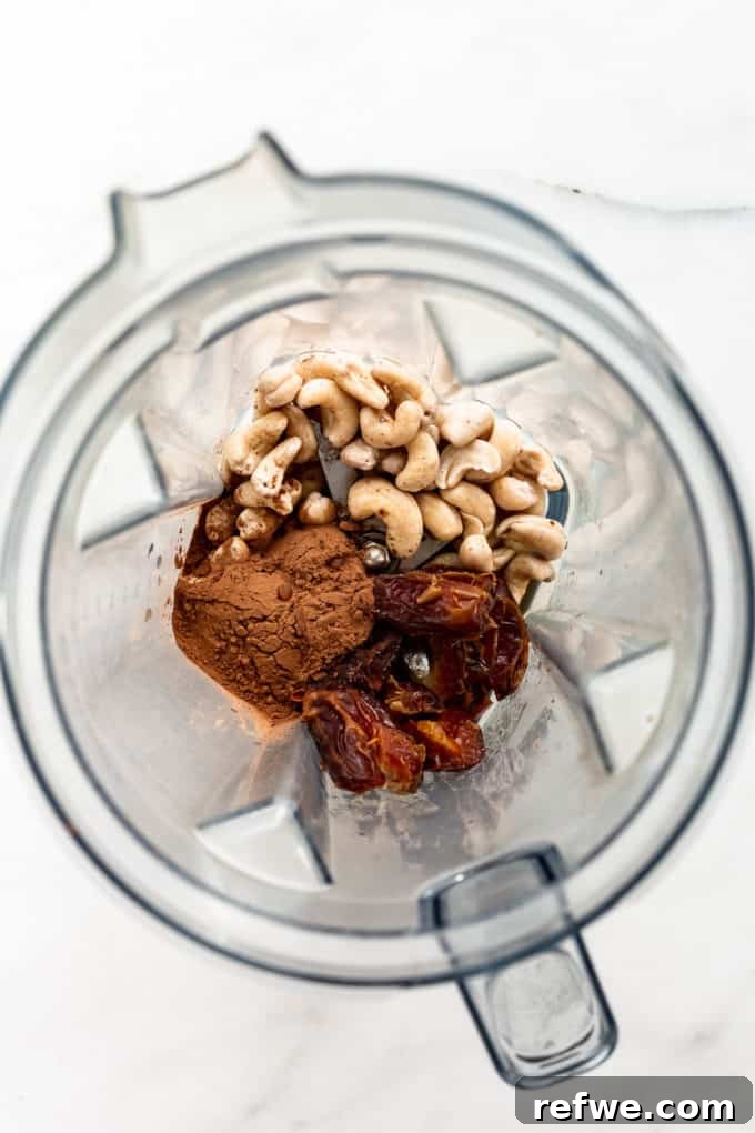 Velvet Mint Chocolate Pudding 3 Raw cashews, Medjool dates, and cocoa powder ready to be blended in a high-speed blender for the pudding base.