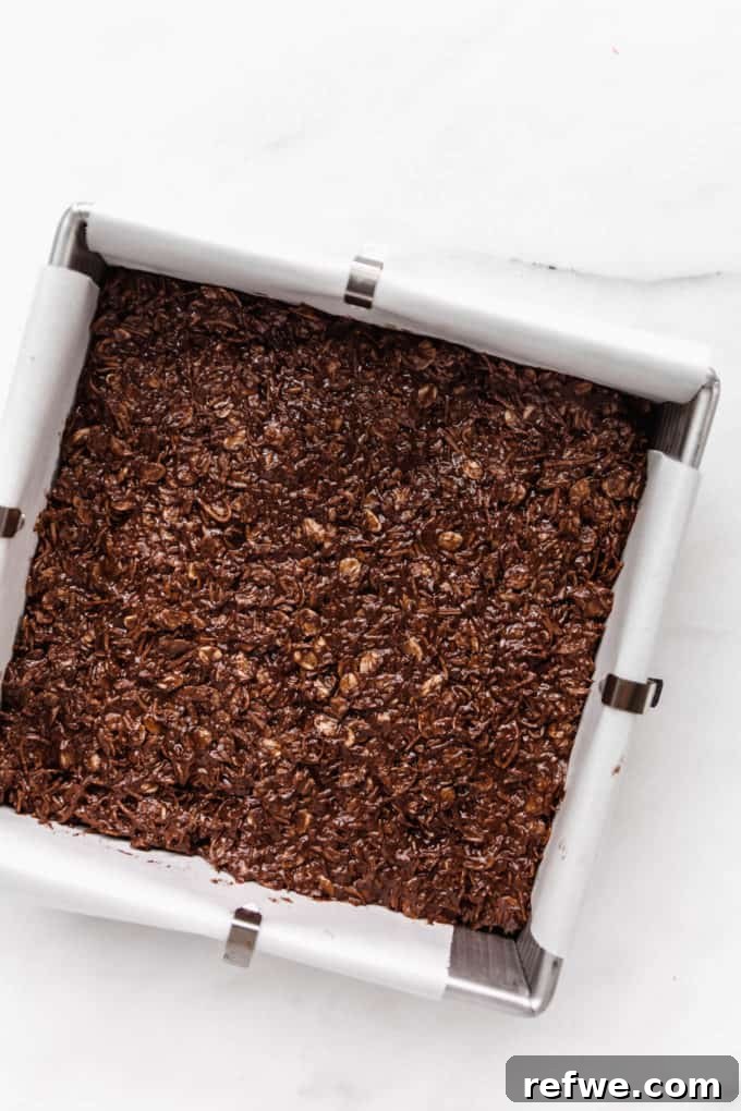 Chocolate Coconut No Bake Dream Bars 7 Smooth chocolate coconut bar batter spread evenly in an 8x8 inch pan, ready for chilling.