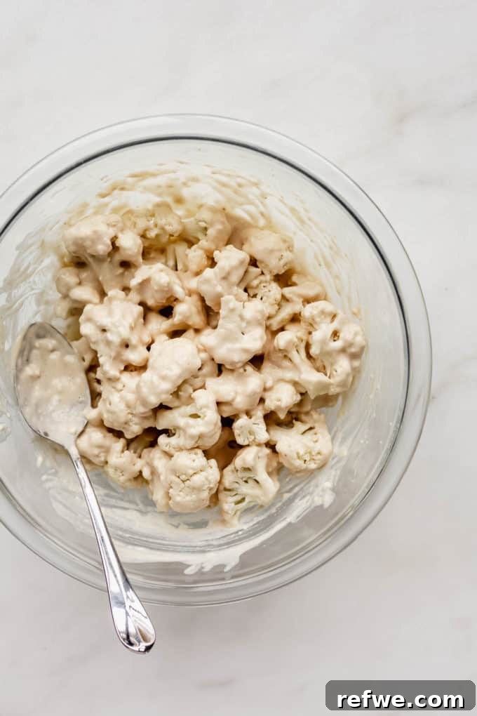 Sunkissed Cauliflower 5 Cauliflower florets perfectly coated in a light batter, ready for the next step of breading.