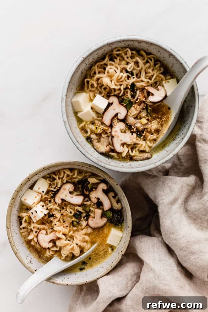 Whip Up Miso Ramen in 15 Minutes 3 Two inviting bowls of Miso Ramen, garnished with fresh greens and shiitake, with chopsticks and a napkin on the side.
