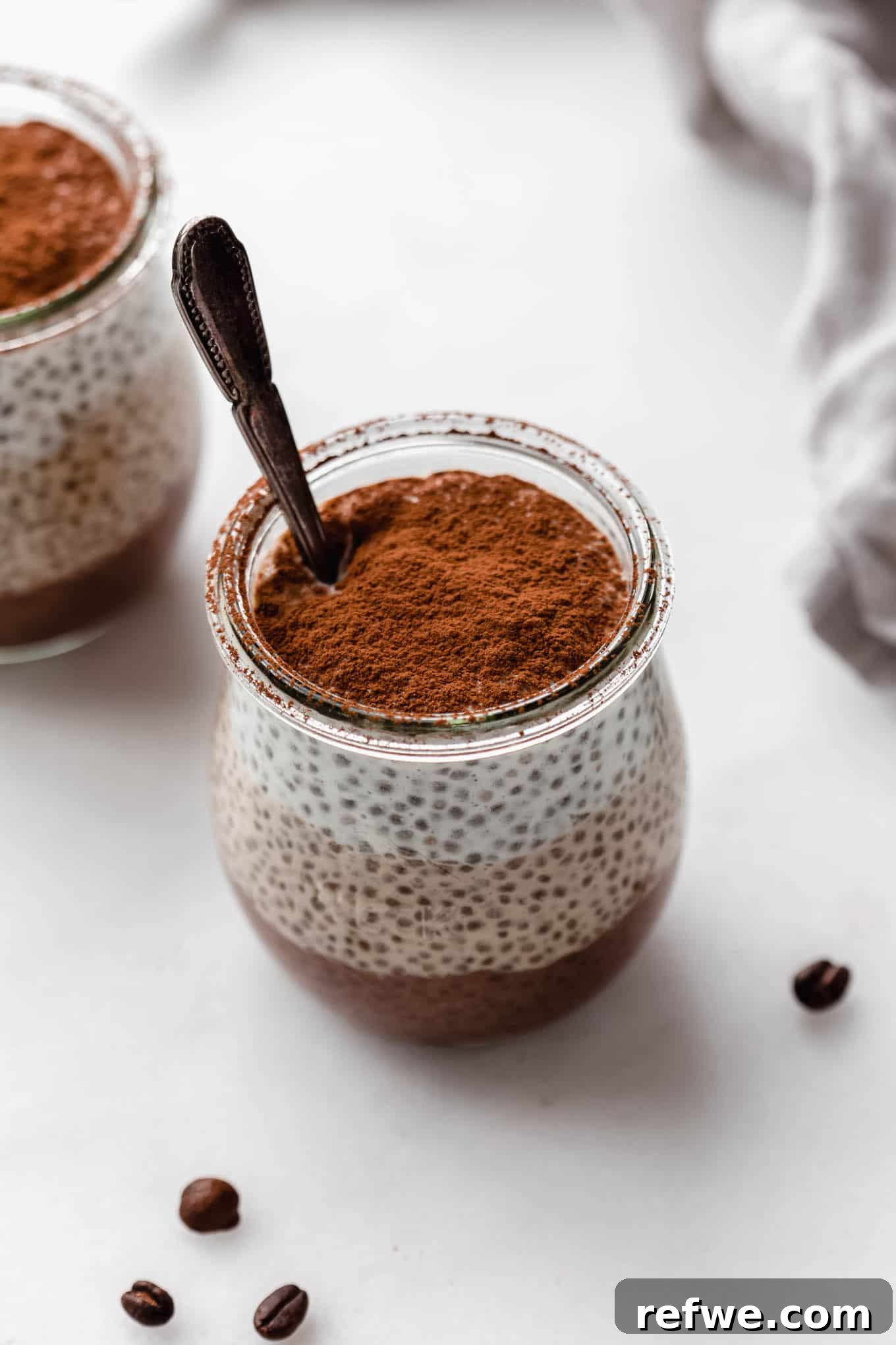 Decadent Tiramisu Chia Pudding 2 A beautiful cup of Tiramisu Chia Pudding, topped with a dusting of cocoa powder, ready to be enjoyed.