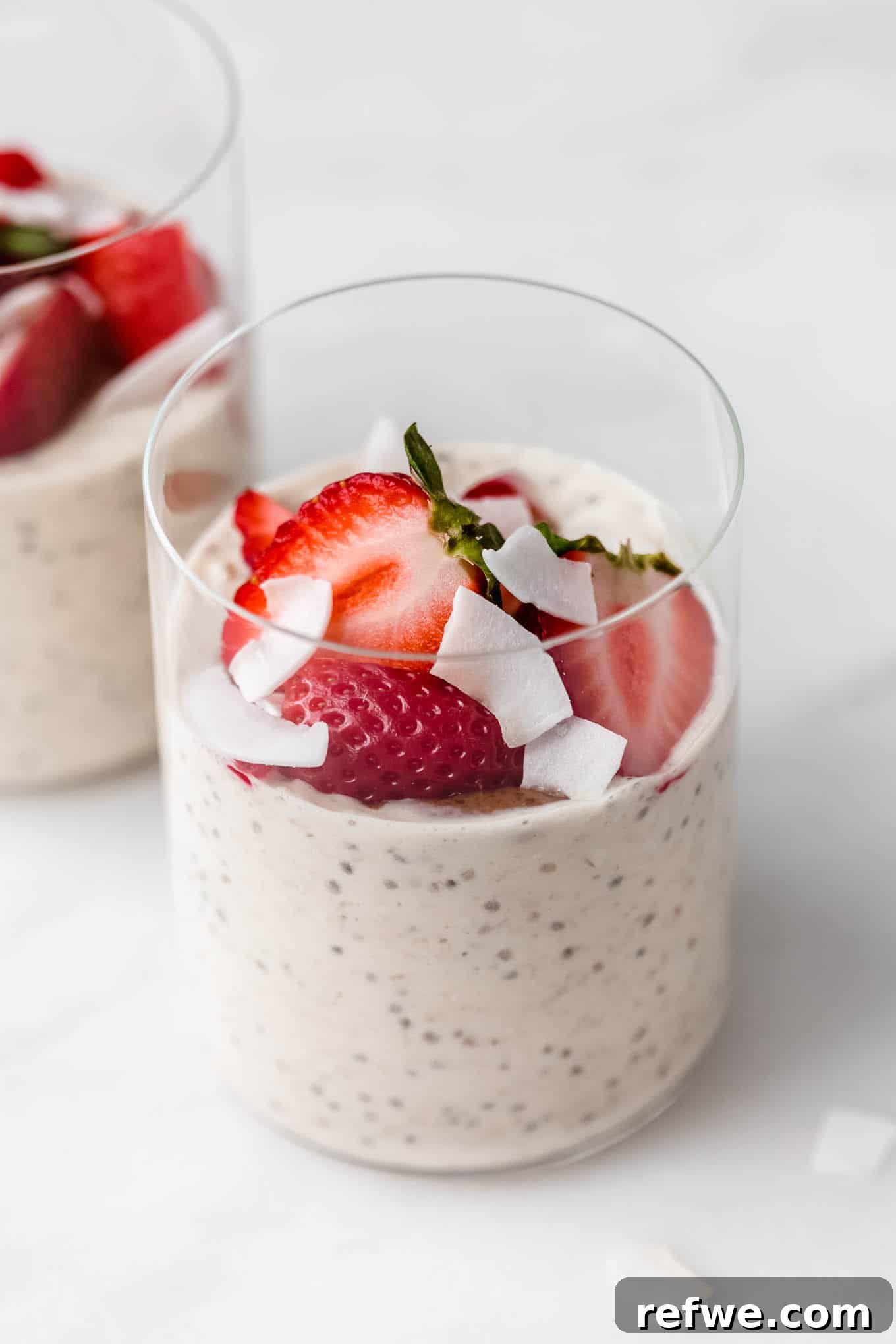 Power Protein Overnight Oats 10 A beautiful cup of protein overnight oats, generously topped with fresh, vibrant strawberries, ready to be enjoyed.
