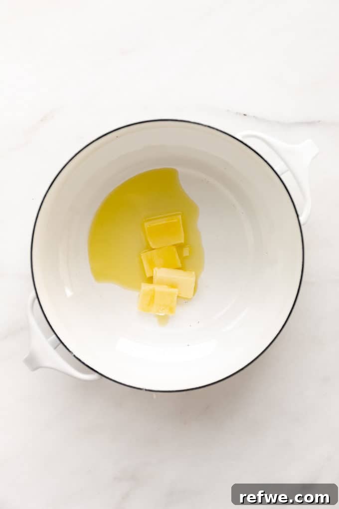 Zesty Lemon Garlic Pasta 3 Butter and olive oil melting together in a white pot, ready for the next step of flavor infusion