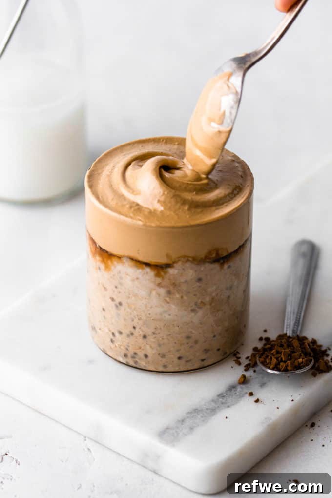 Java Overnight Oats 10 A delectable serving of coffee overnight oats, with a small spoon of instant coffee on the side for an extra kick, perfectly arranged for a morning meal.