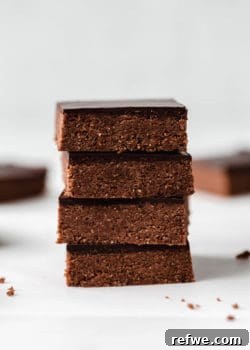 Four chocolate protein bars stacked