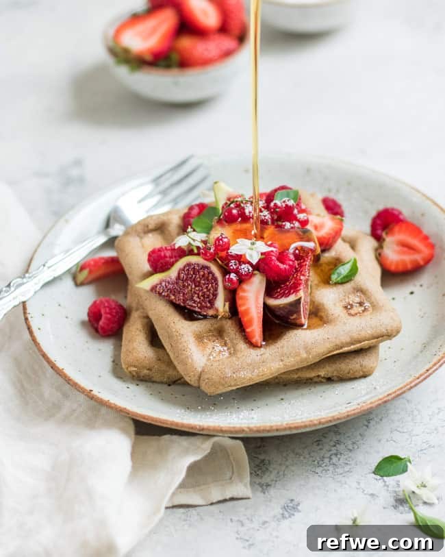 A stack of golden brown vegan buckwheat waffles, perfect for a gluten-free and healthy breakfast or brunch.