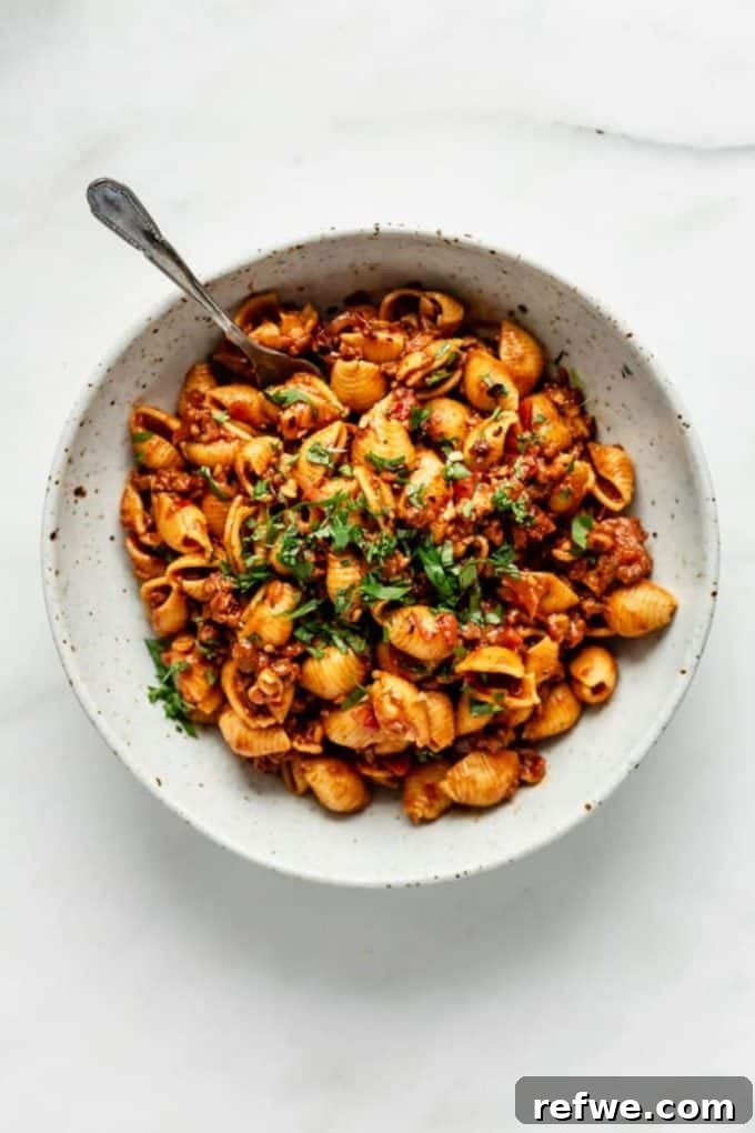 31 Irresistible Vegan Pasta Dishes 18 Shell pasta generously coated in a zesty taco sauce, promising a fusion of flavors.