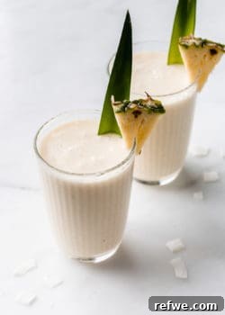 Two glasses of refreshing Pina Colada Smoothies ready to be served