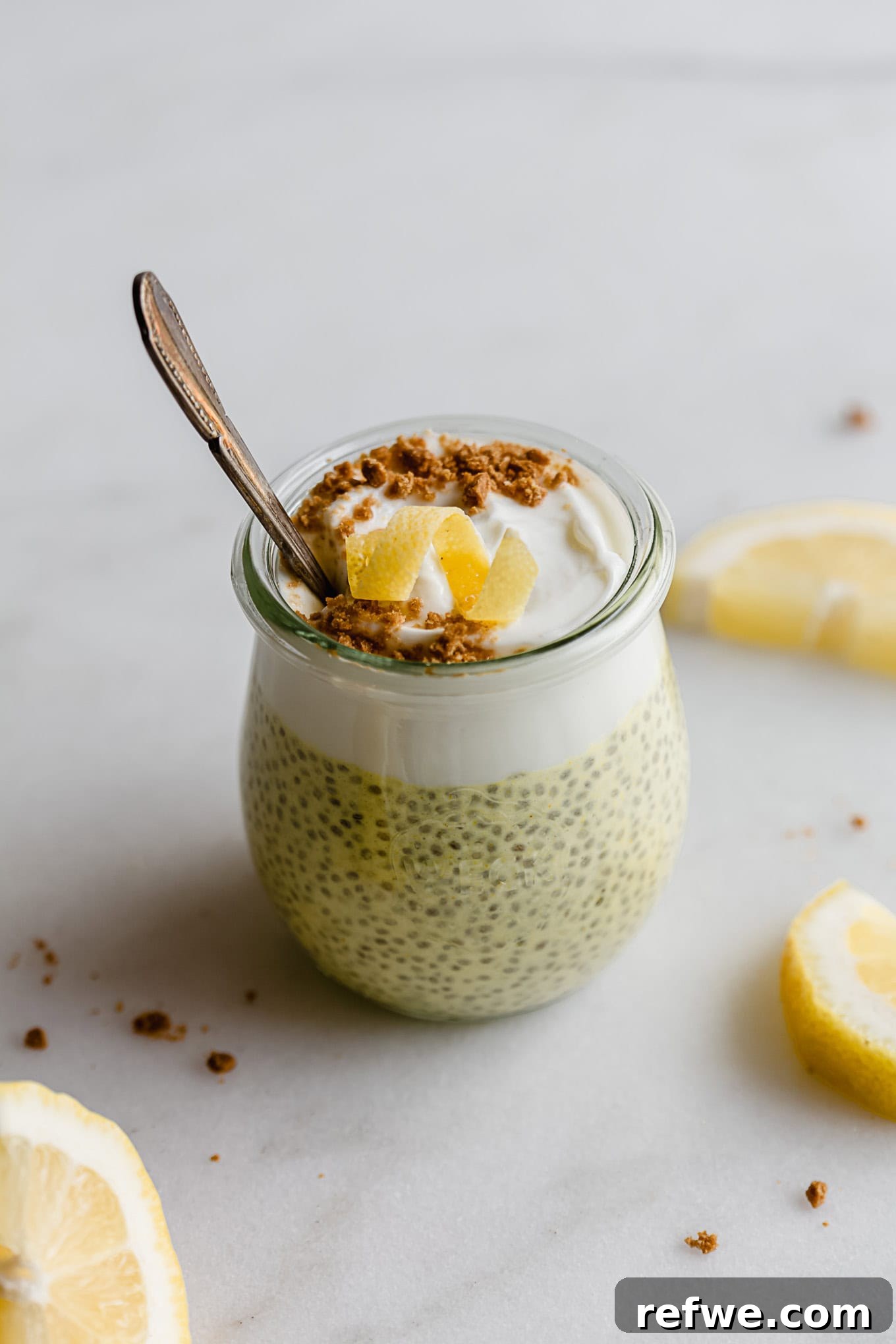 Sunshine Lemon Chia Pudding 10 A beautiful cup of lemon chia pudding topped with creamy yogurt and fresh lemon zest, ready to be enjoyed.
