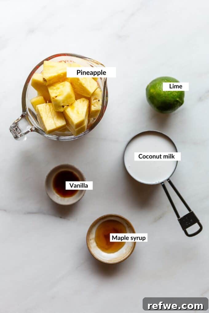 Paradise Pina Colada Pops 3 Ingredients for making creamy Pina Colada Popsicles, including fresh pineapple, coconut milk, lime, vanilla extract, and maple syrup.